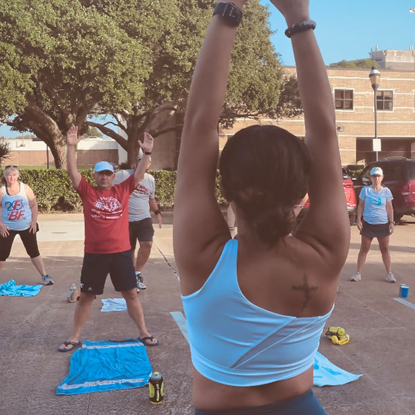Group of people working out outside