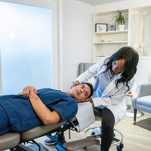 Chiropractor Adjusting a Patient